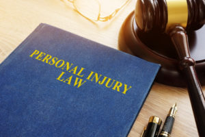 Personal Injury Lawyer Pearland, TX - Personal injury law on a desk and gavel.