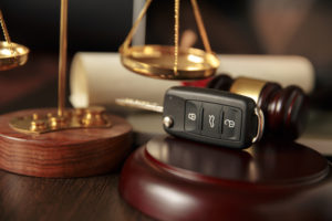 Automotive Litigation Attorney Pearland, TX - Wooden referee hammer and car keys